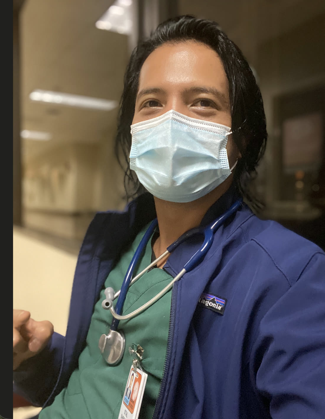 Dr. Shrestha in clinical scrubs and a mask