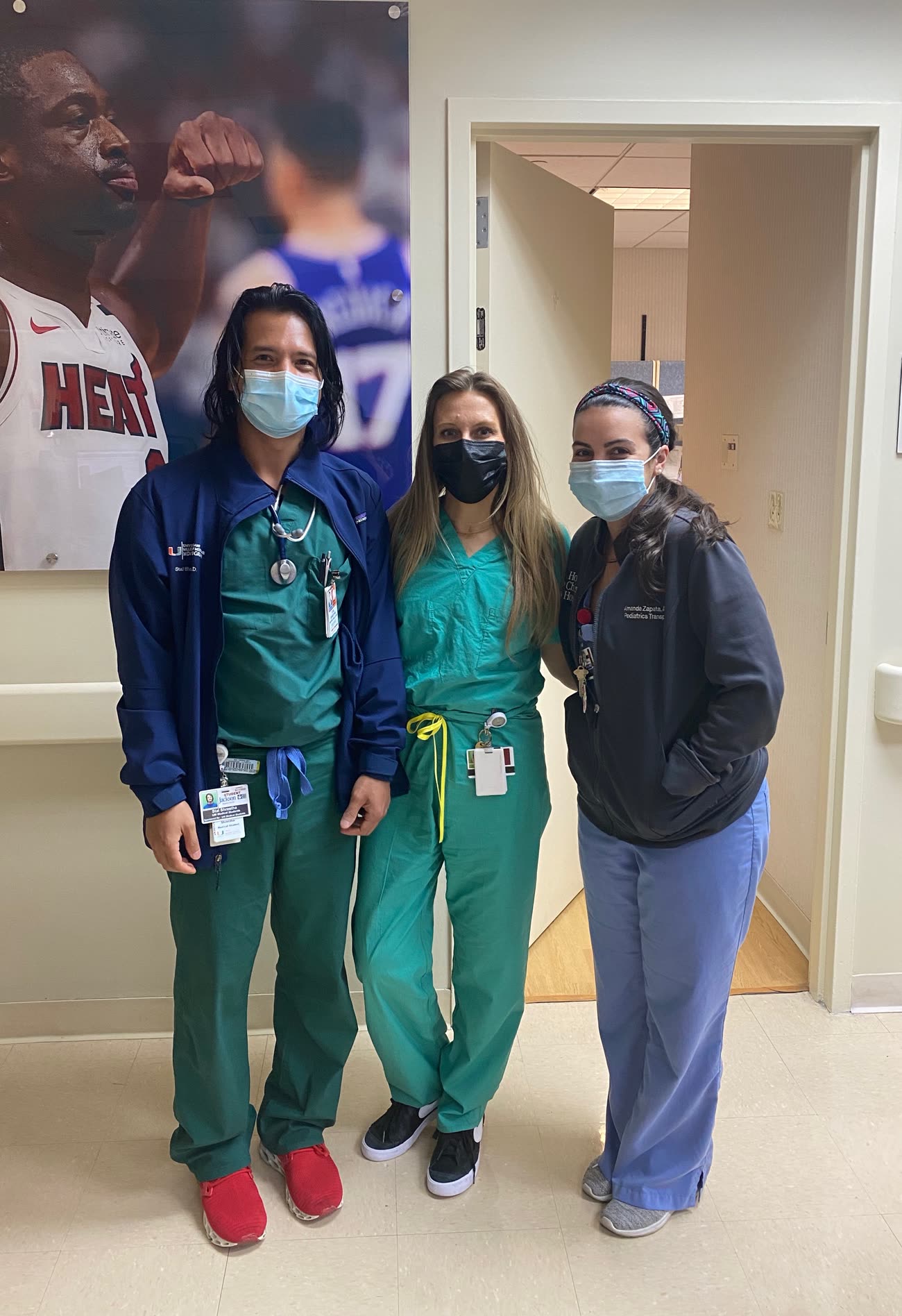 Dr. Shrestha with clinical colleagues in a hospital hallway